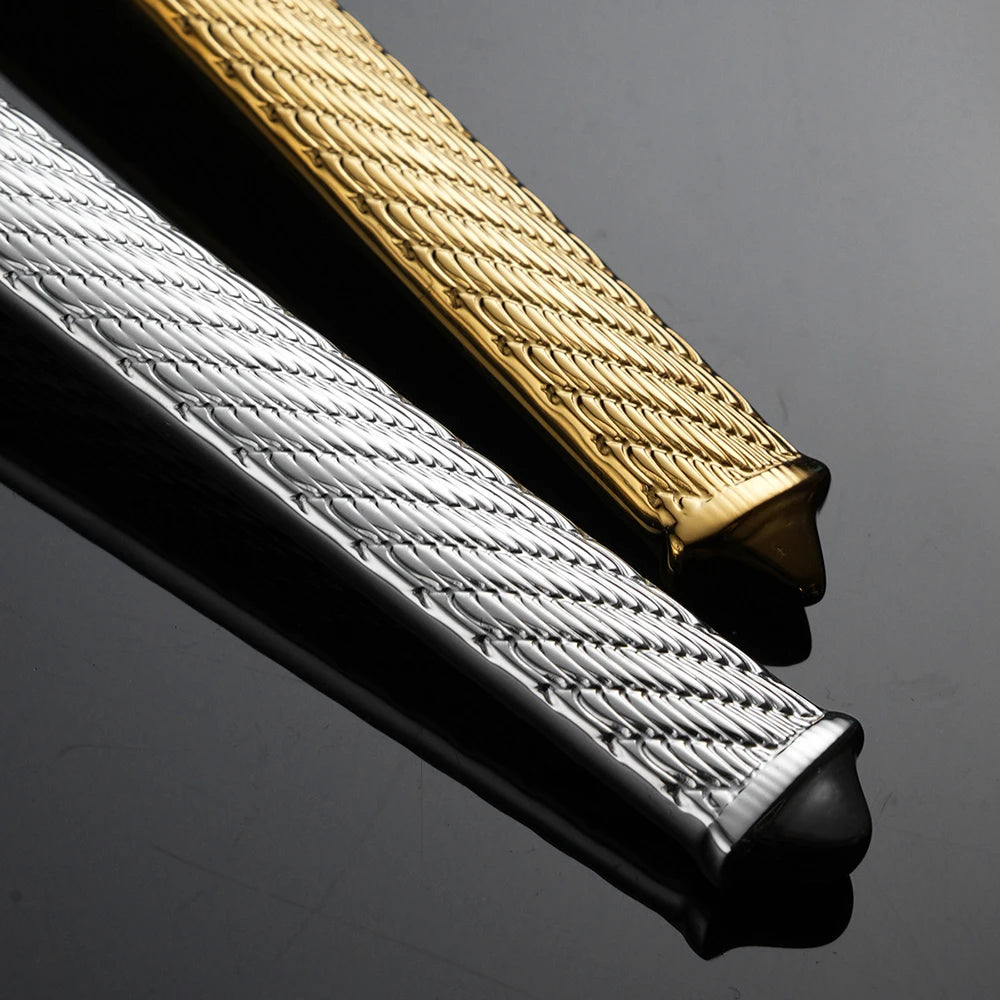 Macro close-up of "Twisted Rope" cutlery handles in Gold and Silver finish — showing the intricate hand-engraved rope texture on 304 stainless steel
