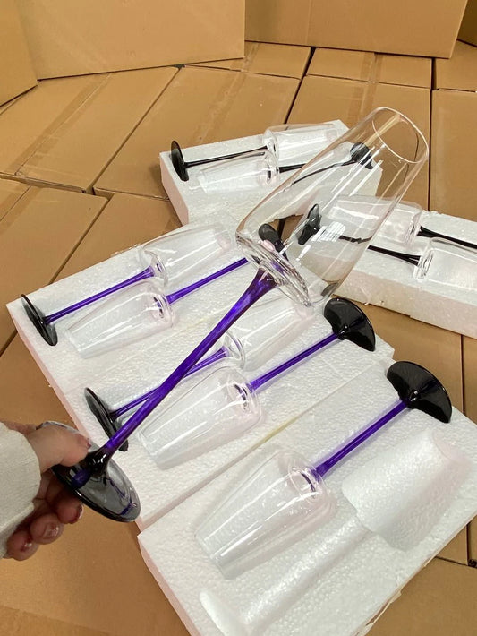 "Stem & Base" crystal champagne flute in Violet Stem variant displayed on its packaging boxes — CL House Drinkware collection