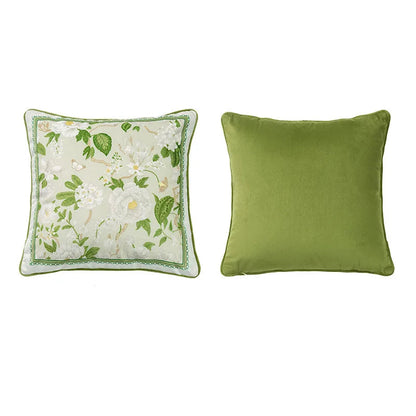 "Garden Whisper" cushion cover, Jasmine Garden Square design — white ground with white jasmine flowers and lush green foliage, honeycomb texture at centre, green piping trim, plain green reverse