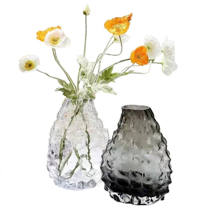 Glacier Peak textured glass vases in Crystal Clear and Smoke Grey styled with orange and white poppies, white background