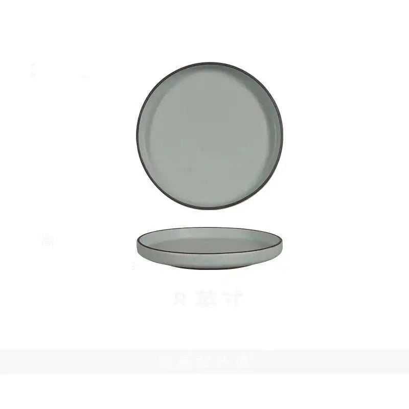  "Spiral Sand" ceramic dinner plate in mist grey with matte finish and straight raised edge — top view and side profile on white background

Próxima! 📷
