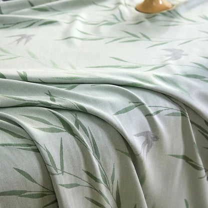 "Close-up of 100% Bamboo Fibre cooling blanket in Willow Mist — soft sage green willow leaf print showing the fine texture and breathable weave of the bamboo fabric"