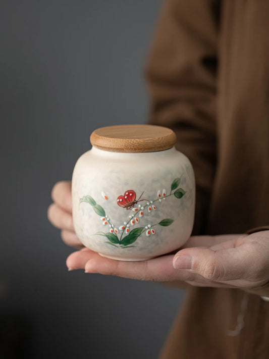 Hand-painted tea jar

Ceramic tea caddy 

Portable tea storage

Pu-erh tea canister

Moisture-proof tea can

Artisan ceramic storage

Small tea tin alternative

Luxury tea accessories