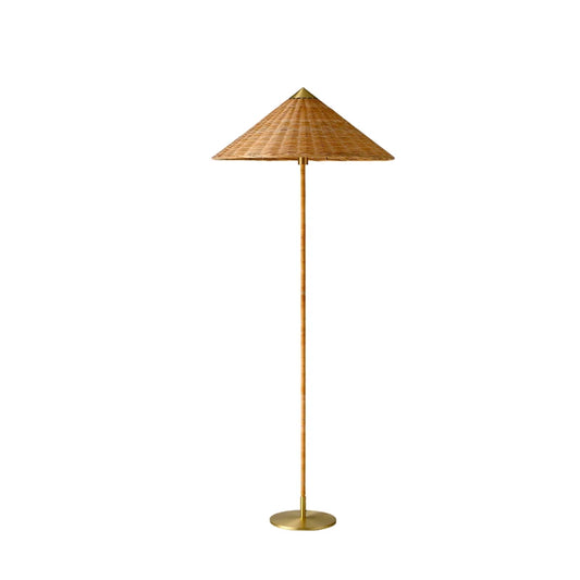 "Cone & Brass" floor lamp with natural rattan conical shade and brass stem on white background
