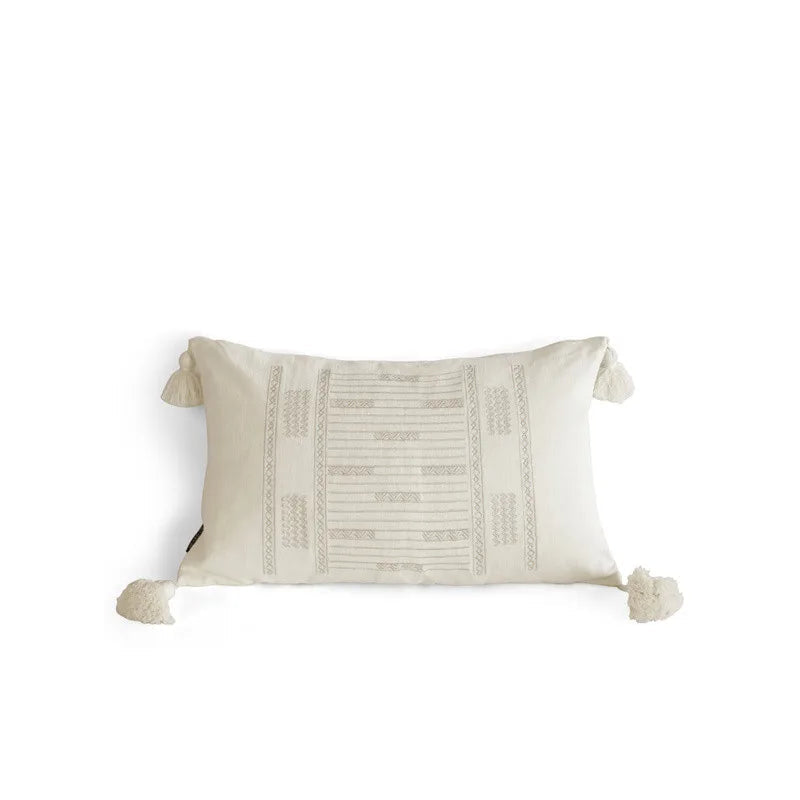 Ivory tassel lumbar cushion cover with geometric jacquard weaving and hand-knotted corner tassels, photographed on a white background — handcrafted ramie-linen blend, 30x50cm, boho Japandi home decor.