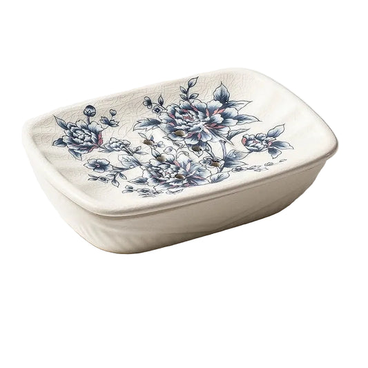 Rectangular flat ceramic soap dish with blue peony chinoiserie print and crackle-glaze finish, angled view on white background