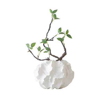 Crinkle Cloud white ceramic vase styled with green branches on white desk beside miniature record player