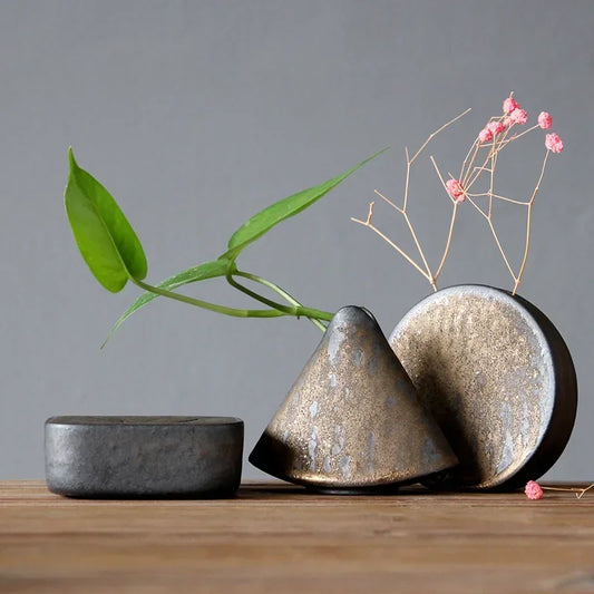 "Silent Mountain" Stoneware Vase — full set of three ceramic forms in volcanic bronze glaze with dried flowers and green stems, wabi-sabi ikebana decor