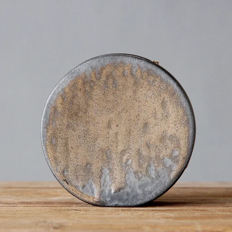 "Silent Mountain" Stoneware Vase — Moon disc form in coarse stoneware with natural bronze glaze variations, zen ceramic accent for shelves and sideboards