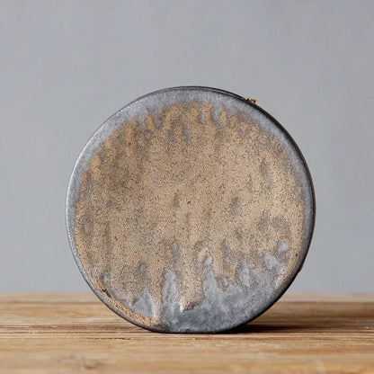 "Silent Mountain" Stoneware Vase — Moon disc form in coarse stoneware with natural bronze glaze variations, zen ceramic accent for shelves and sideboards