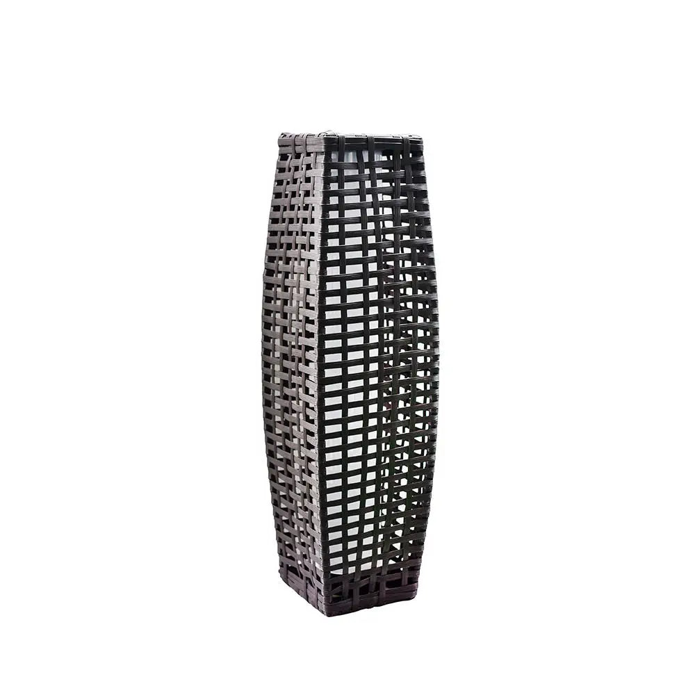 Tall woven wicker solar floor lantern in dark brown, concave column silhouette — front view on white background