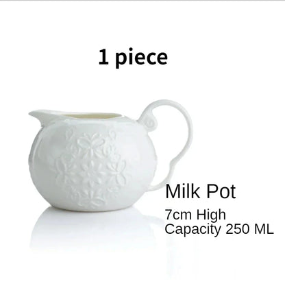  (Milk Jug):

"White embossed bone china milk jug with floral relief and curved handle — CL House Tea Time"