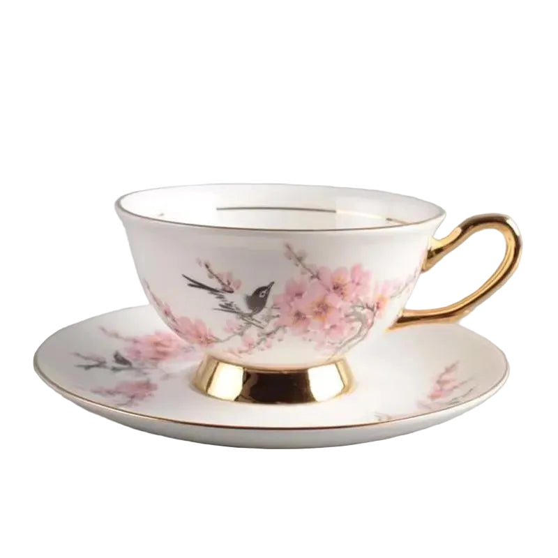  Magnolia & Sparrow:

"White bone china teacup and saucer with magnolia and sparrow print and gold trim  — CL House Tea Time"
