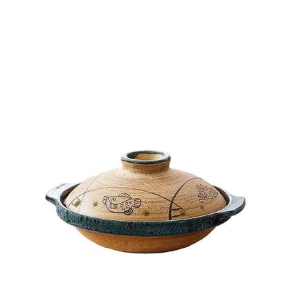 "Fish & Grass" ceramic donabe casserole — front view on white background showing full silhouette with sandy terracotta lid, hand-etched fish and leaf motifs, teal green glazed rim and base, and dual side handles — product shot