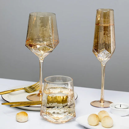 "Amber Geo" iridescent crystal glasses in Amber Wine and Amber Flute variants together — CL House Drinkware collection