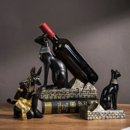 Anubis wine bottle rack

Bastet cat wine holder 

Egyptian bar ornaments

Ancient Egypt home decor

Resin wine bottle stand

Goddess Bastet statue wine rack

Mythological barware gifts

Luxury wine display stand

Artisanal Egyptian crafts