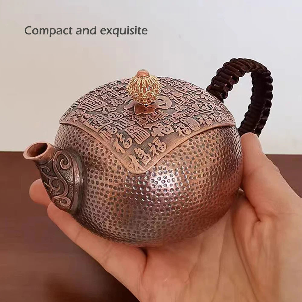 Hand pouring tea from pure copper teapot into cup — CL House Tea Time