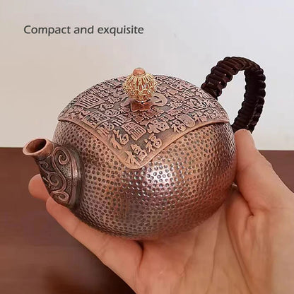 Hand pouring tea from pure copper teapot into cup — CL House Tea Time