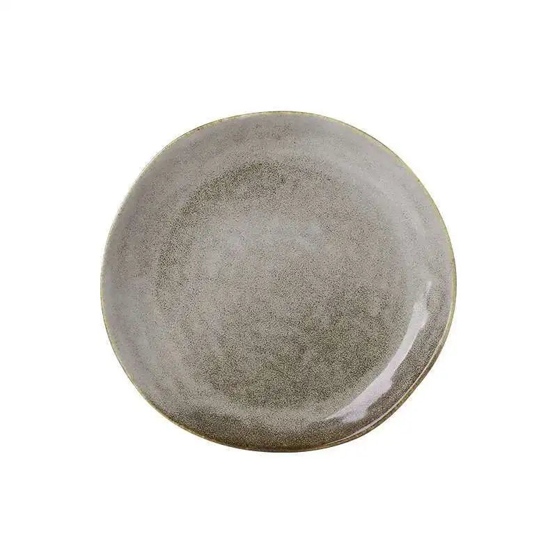  "Speckled Stone" ceramic dinner plate in matte grey with reactive glaze finish — top view and side profile on white background