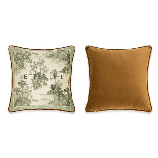 : "Better Life" botanical velvet cushion cover front and back view, cream ground with sage green border, tropical toile landscape with palm trees and river in deep green ink, bold "Better Life" typographic centre, plain caramel velvet reverse with orange piping — CL House Cushions collection