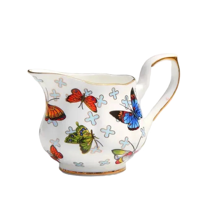 (Milk Jug 180ml):

"White bone china milk jug with butterfly botanical print and gold trim, 180ml — CL House"