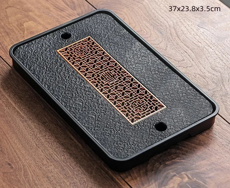 Gongfu Cha Pan Stone Drainage Tea Tray – angled view, round copper honeycomb lattice on dark stone surface | CL House