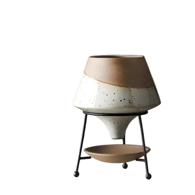 Speckled white reactive glaze ceramic cone plant pot on matte black iron tripod stand with ceramic drainage saucer, dimensions 9.5cm opening, 21cm height, 15cm base width, grey background