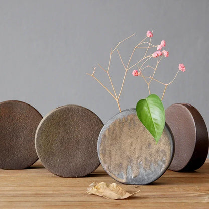"Silent Mountain" Stoneware Vase — Moon disc form in coarse stoneware with natural bronze glaze variations, zen ceramic accent for shelves and sideboards