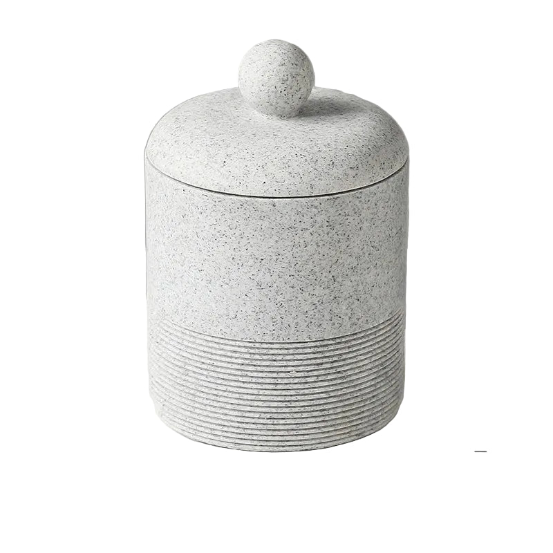 Slate Stone wabi-sabi ceramic storage jar with domed lid and round ball knob, full front view on white background showing speckled stone texture and ribbed base detail