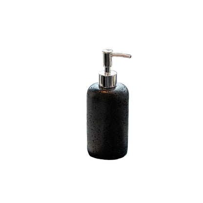 Midnight Stone travertine-texture soap dispenser with polished chrome pump, full front view on white background showing deep dark pitted stone finish