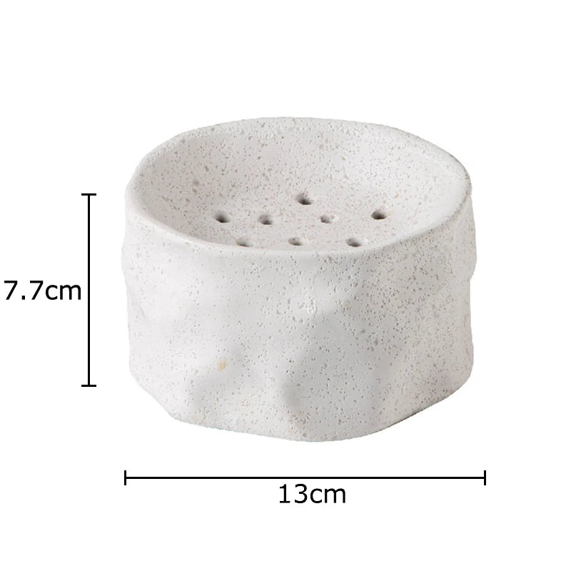  "Sand kenzan ceramic ikebana bowl, 13×7.7cm, earthy speckled glaze, white background"