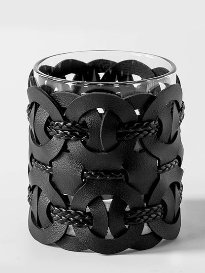 Midnight Weave woven leather and glass bathroom organiser, full front view on white background showing matte black interlocking ring pattern and braided cord detail
