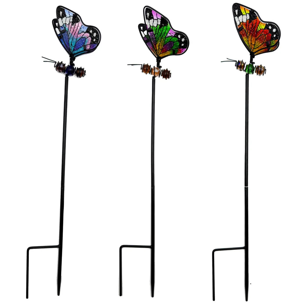 "Garden Wings" set of 3 stained glass effect metal butterfly garden stakes in blue-purple, neon green and orange-red tones, white background