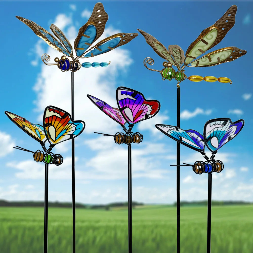 "Garden Wings" collection of stained glass effect metal butterfly and dragonfly garden stakes displayed against blue sky, showing Butterfly Trio A and Dragonfly Glow Duo sets