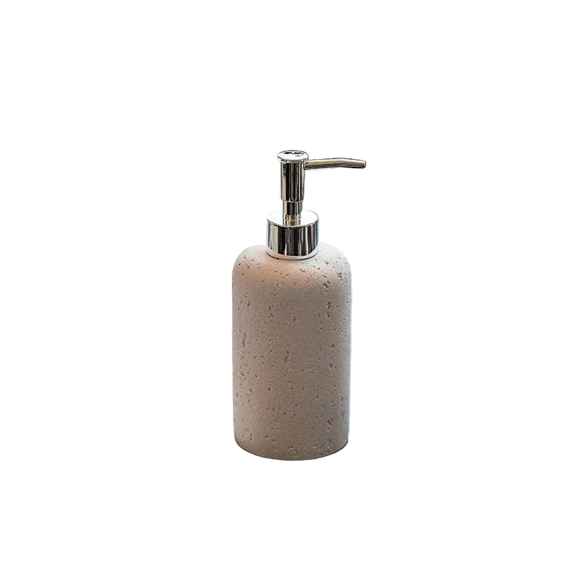 Chalk Stone travertine-texture soap dispenser with polished chrome pump, full front view on white background showing warm cream pitted stone finish