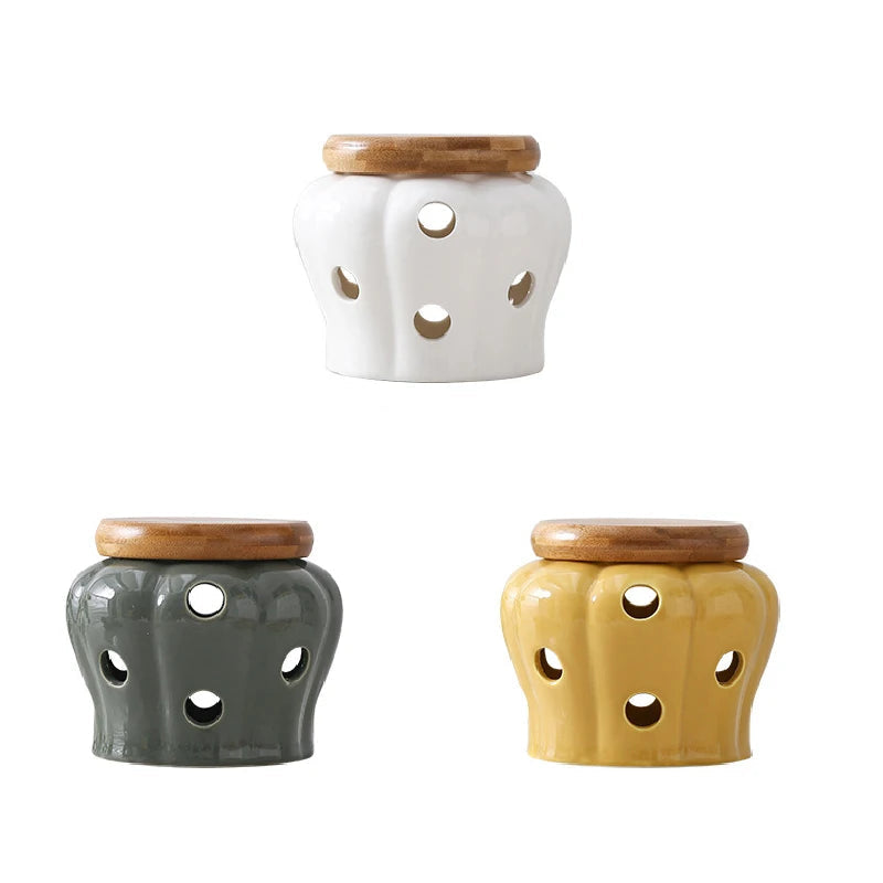 Pumpkin-shaped ceramic garlic and ginger storage jars with bamboo lids in chalk white, slate grey and mustard yellow, CL House & Home