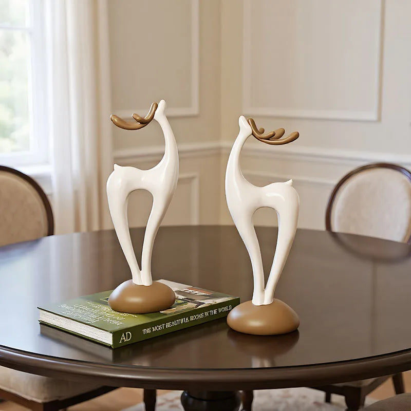 "Stone Stack" Deer Sculptures — pair, abstract ivory resin with walnut base
