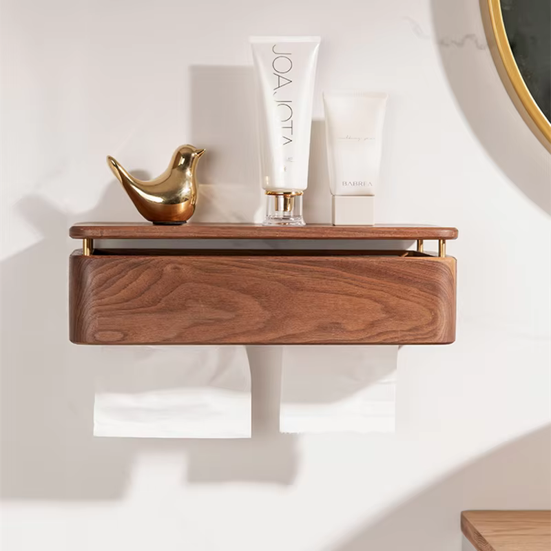  Large walnut wood wall-mounted tissue holder with brass rail, top shelf styled with gold bird figurine and skincare products, paper roll below — japandi bathroom organisation