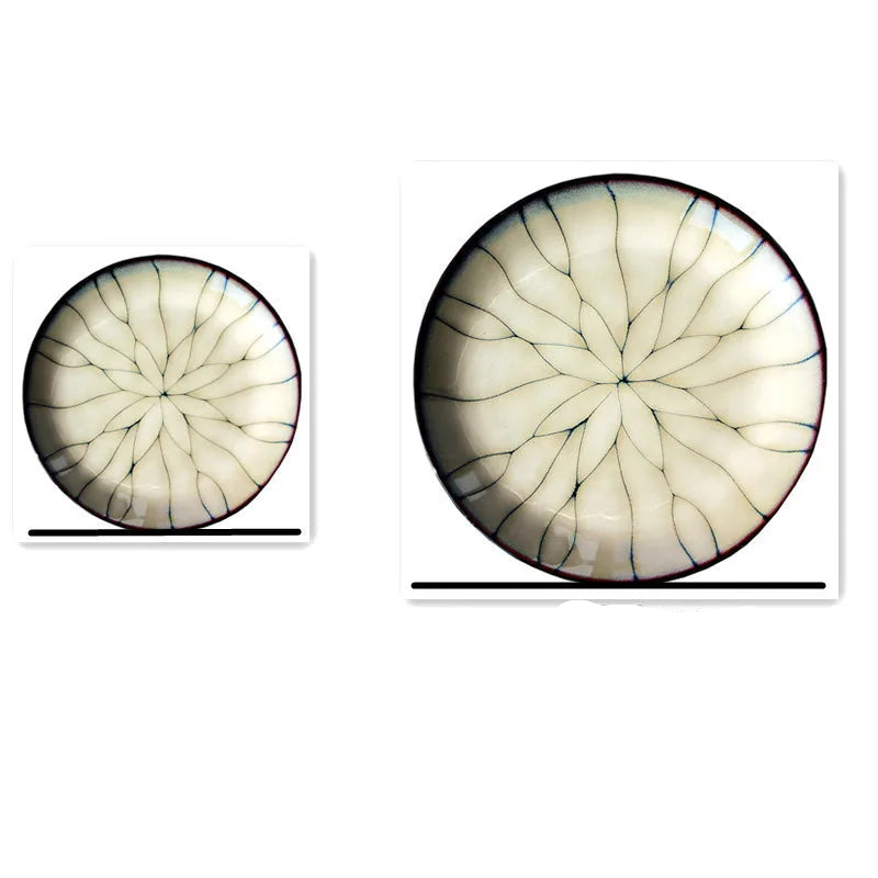 "Lotus Web" ceramic dinner plates side by side showing size comparison — Small and Large with lotus petal kiln-change glaze pattern on white background
