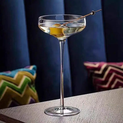  "Long Stem" coupe cocktail glass with a vibrant cocktail, elegant wide bowl and elongated stem — CL House Drinkware collection