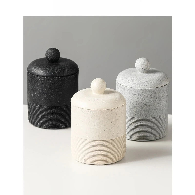 Three Stone Jar ceramic storage jars with lids — Chalk Stone front, Midnight Stone and Slate Stone behind — styled group shot on white surface with grey background