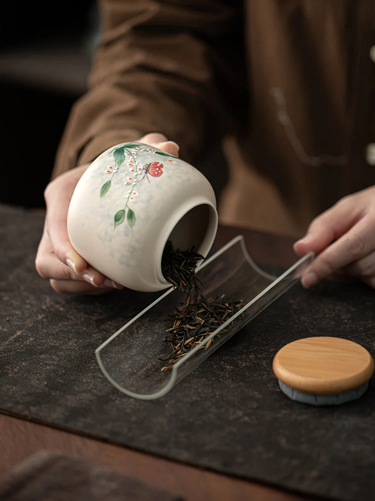 Hand-painted tea jar

Ceramic tea caddy 

Portable tea storage

Pu-erh tea canister

Moisture-proof tea can

Artisan ceramic storage

Small tea tin alternative

Luxury tea accessories