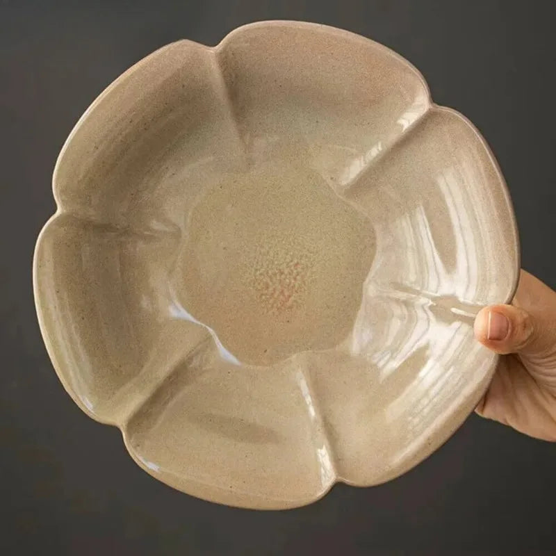  Underside of ivory petal ceramic dish showing unglazed stoneware foot ring, natural texture detail
