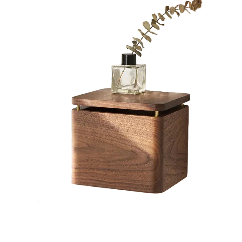 : Walnut wood tissue holder small size on white background with glass reed diffuser and dried eucalyptus branch on top, brass hinge detail visible — japandi bathroom accessory