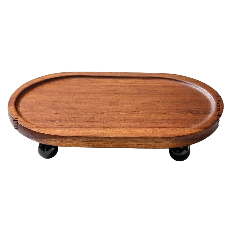 Oval acacia wood bathroom tray with black ball feet, warm walnut finish, 19.8cm length, white background