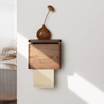  Walnut wood wall-mounted tissue holder with small ceramic bud vase on top shelf, paper roll dispensing below, warm natural light on white wall — wabi-sabi bathroom decor