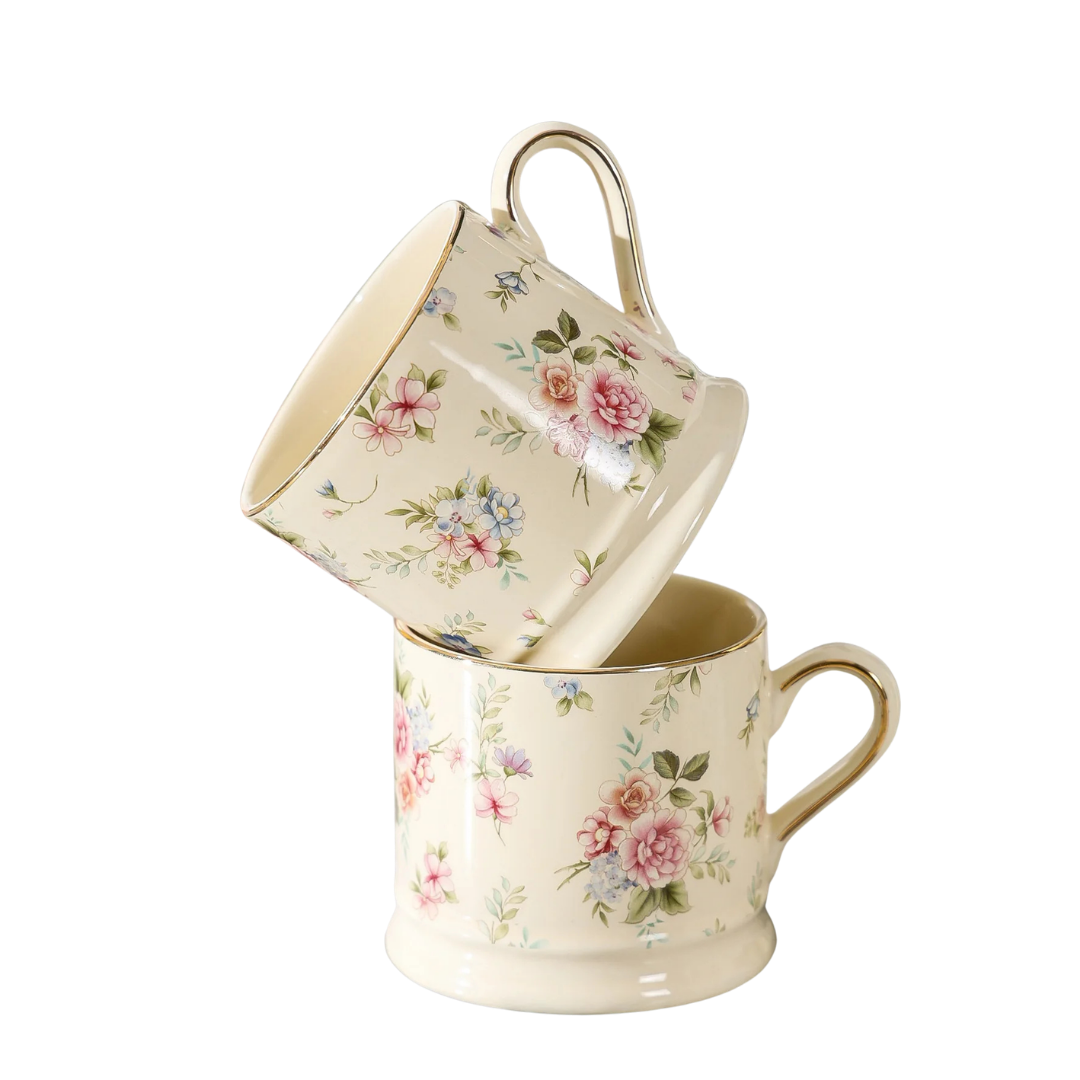 Two "English Garden" floral ceramic mugs stacked, with pink rose print and gold rim detail, white background — CL House & Home