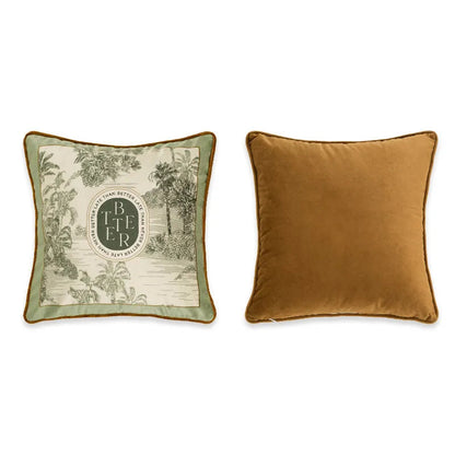  "Better Late" tropical toile velvet cushion cover front and back view, cream ground with sage green border, tropical landscape toile with palm trees, oval "Better Late Than Never" medallion, plain caramel velvet reverse with coordinating piping — CL House Cushions collection