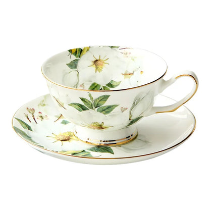 "White Camellia" fine bone china tea cup with camellia floral design and gold rim on white background — CL House & 