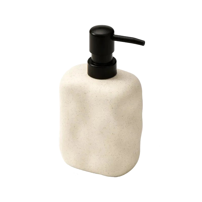 Sand Form wabi-sabi ceramic soap dispenser with matte black pump, angled front view on white background showing sandy stone texture and organic form